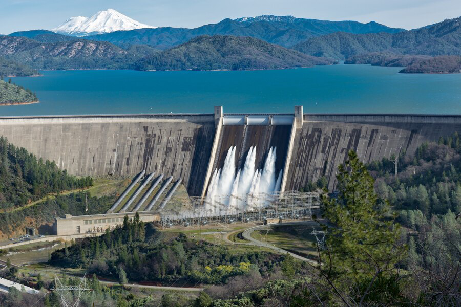 picture shasta dam surrounded by roads trees with lake mountains